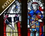 Stained glass window depicting Jasper Tudor and his wife, Catherine Woodville