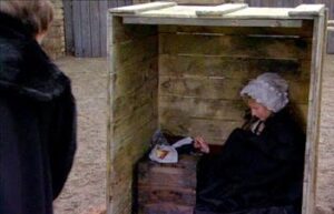 Still from the Tudors series showing Cranmer's wife in a box